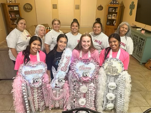 The family behind Mumorabilia holding custom homecoming mums